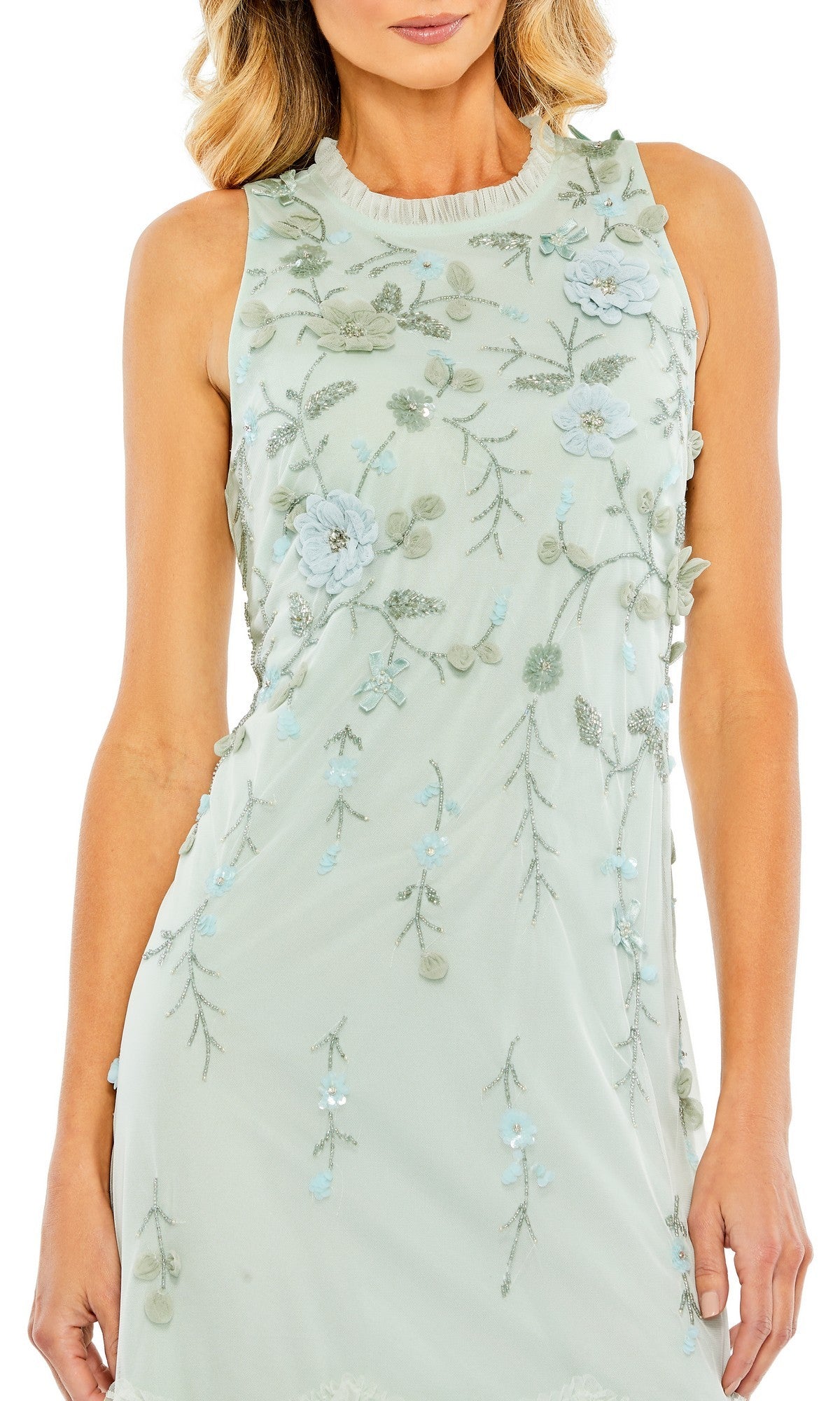A woman wears the Mac Duggal 9188 Midi Wedding Guest Dress, a sleeveless light green dress with blue and green floral embroidery and appliqué—an elegant choice for wedding guests.